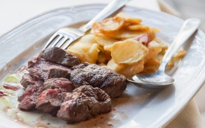 Dry Aged entrecote steak grilled with golden brown potato slices